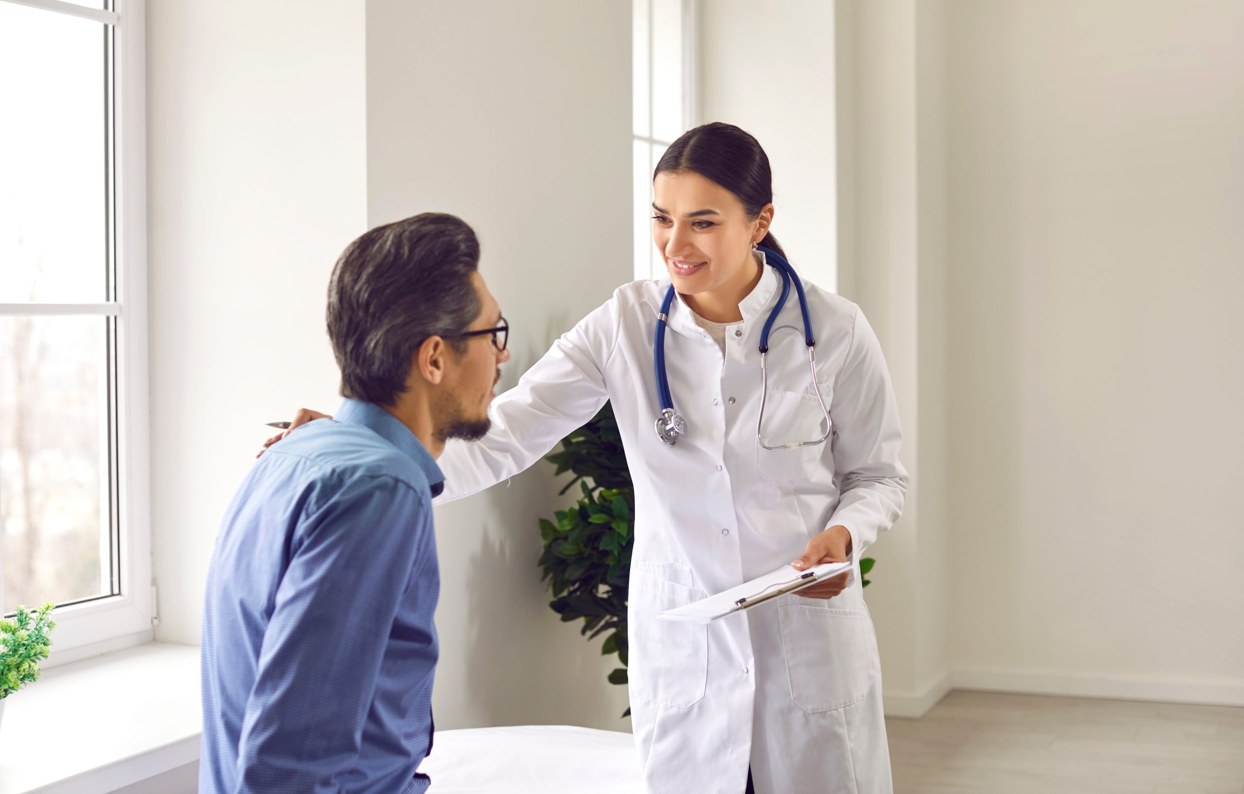 a female doctor giving good news to a patient